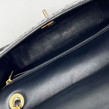 Chanel 2023 medium woven flap bag