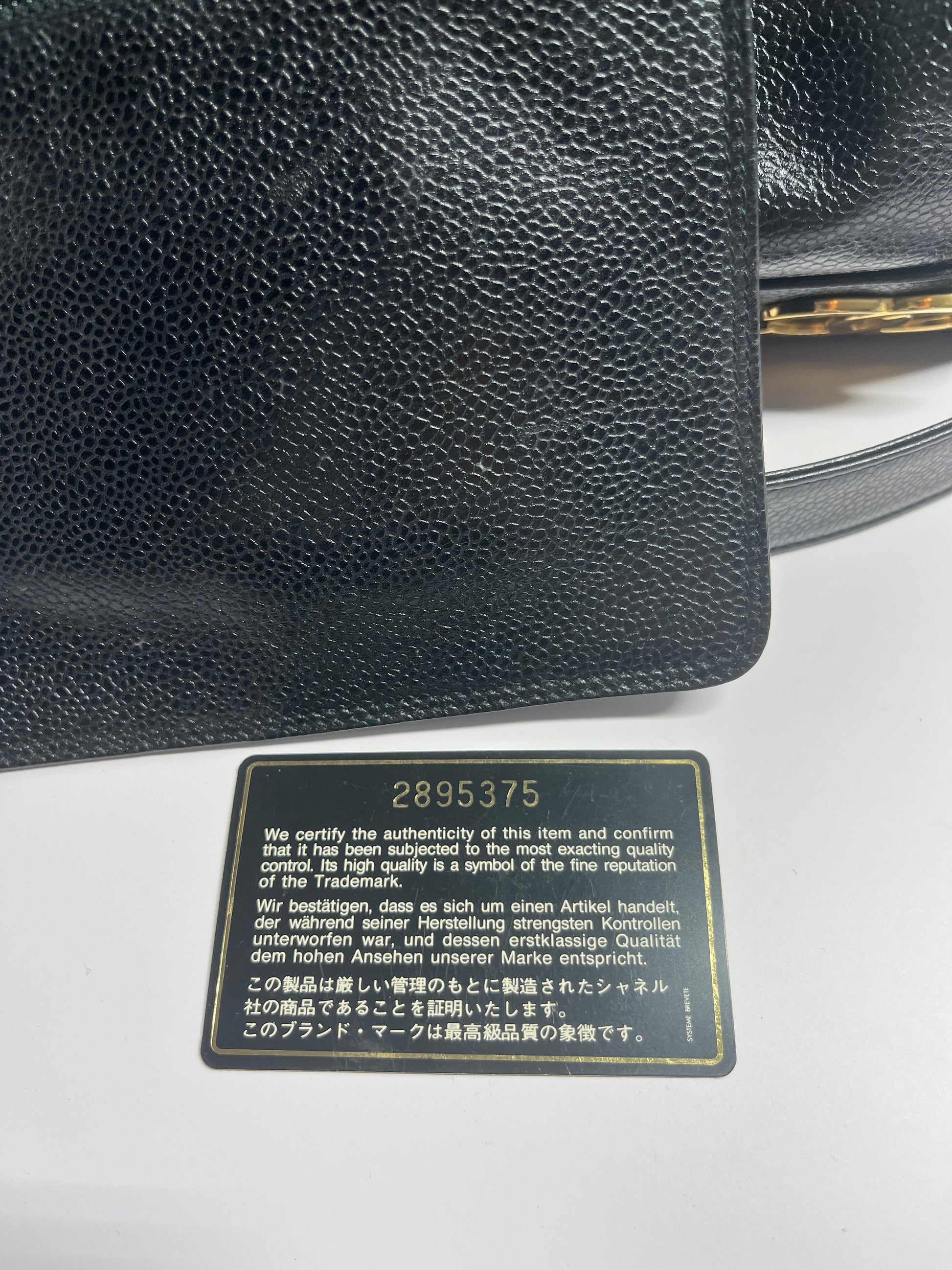 Chanel bucket black leather gold ball shoulder bag