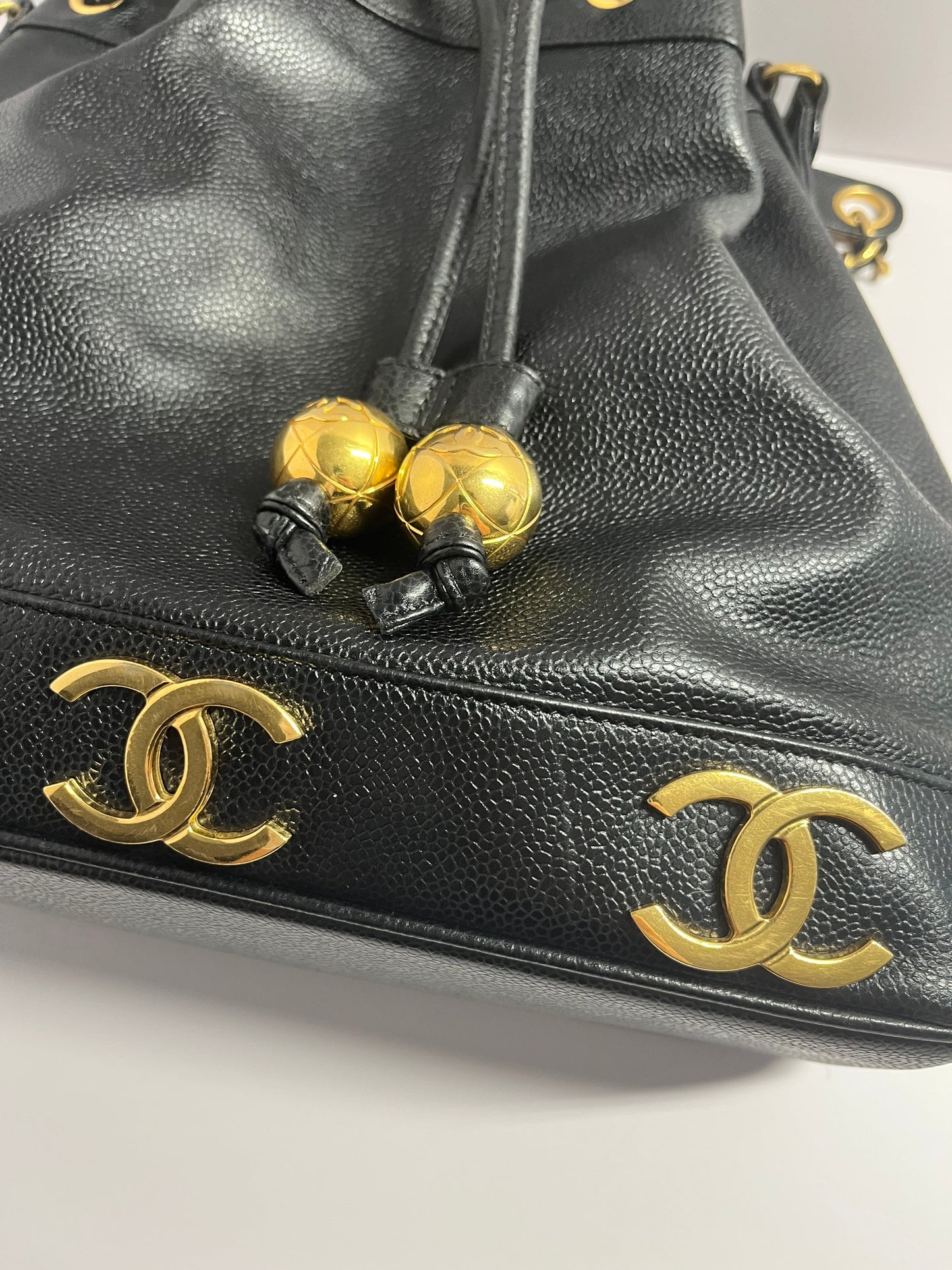Chanel bucket black leather gold ball shoulder bag