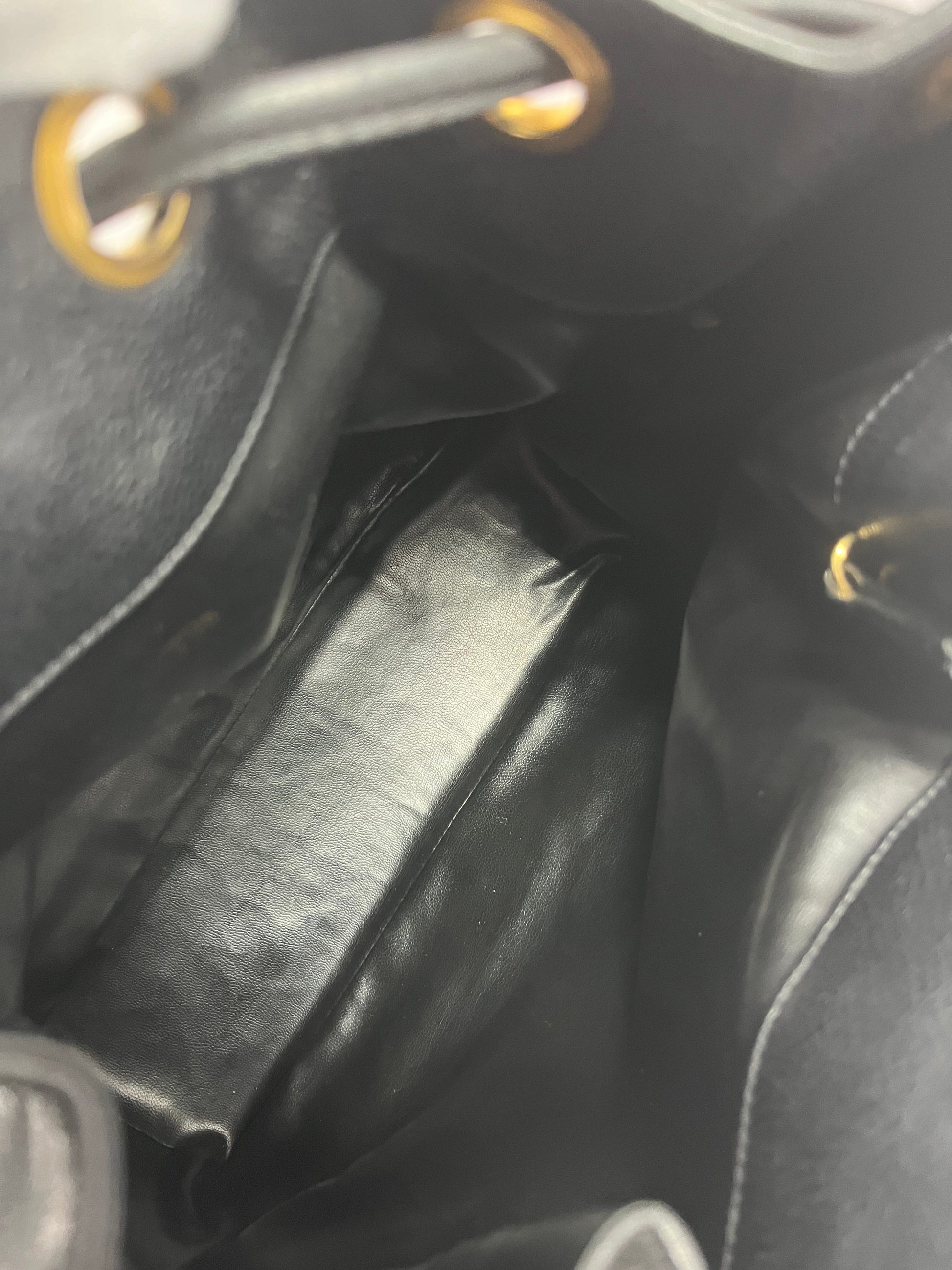 Chanel bucket black leather gold ball shoulder bag