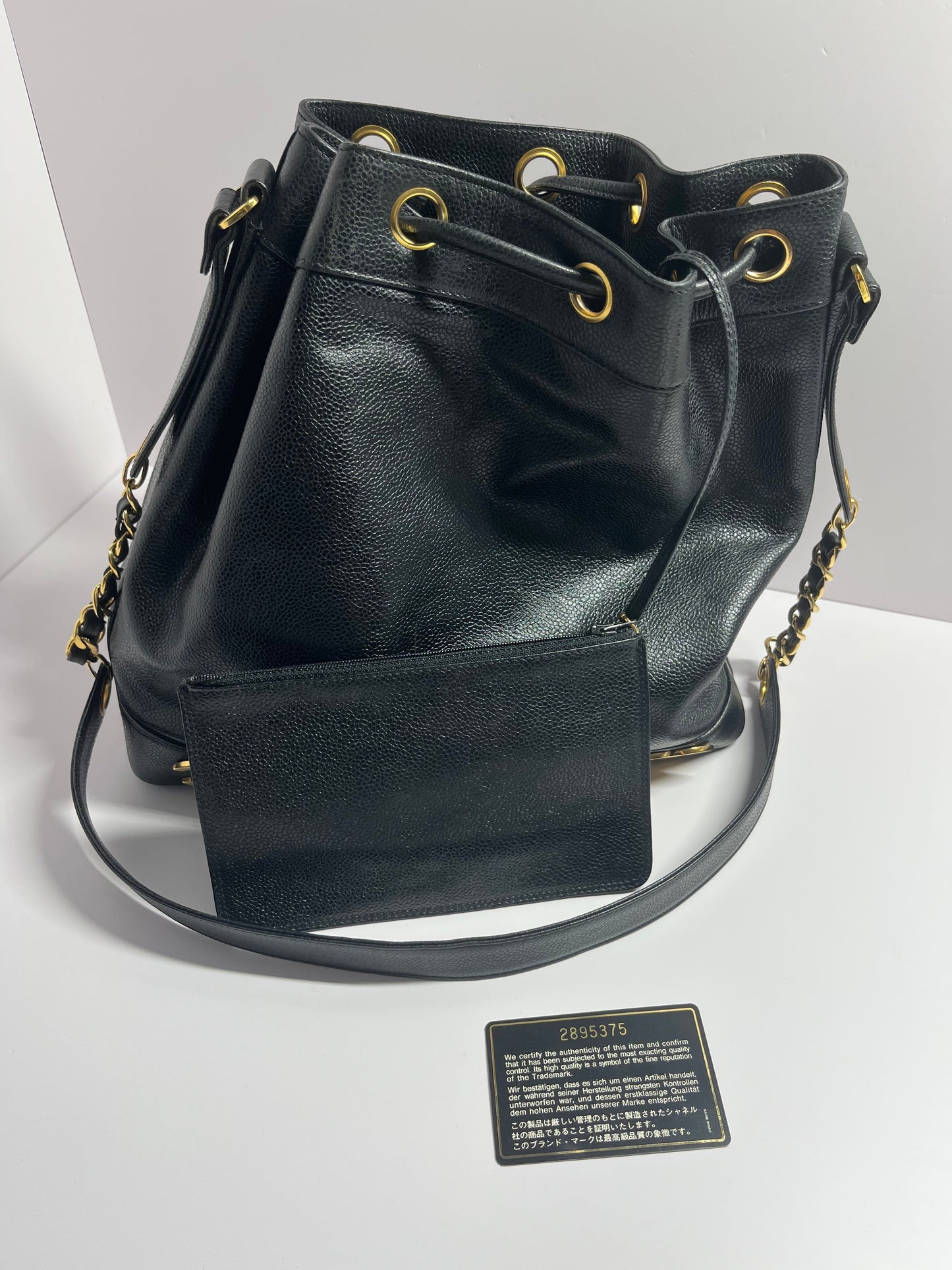 Chanel bucket black leather gold ball shoulder bag