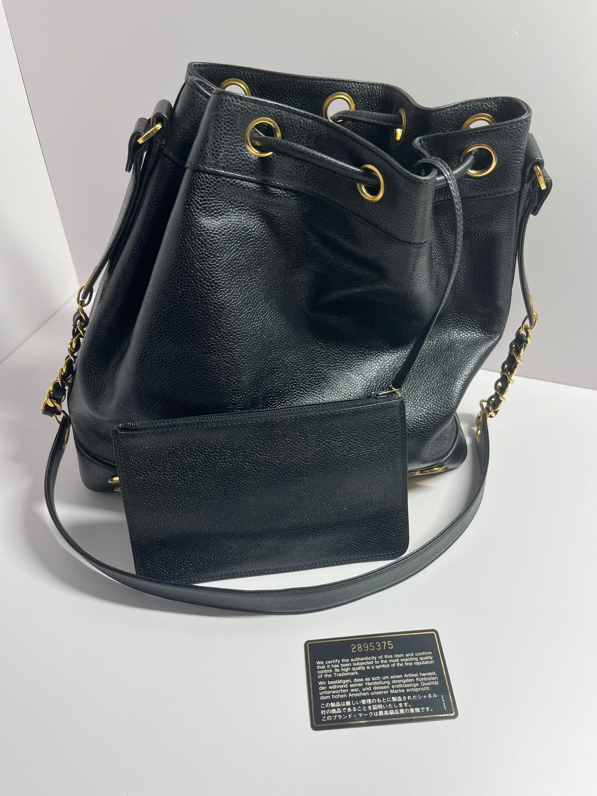 Chanel bucket black leather gold ball shoulder bag