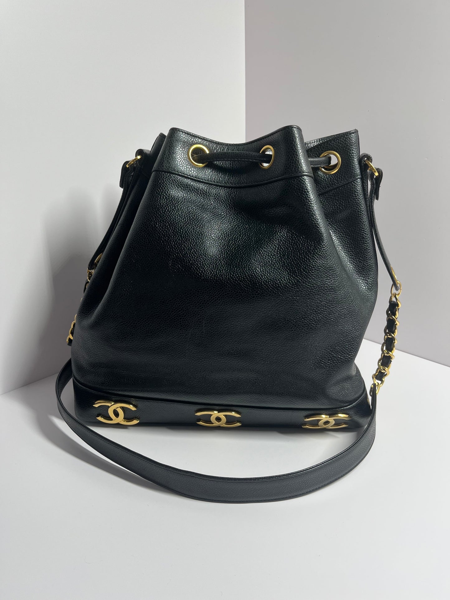 Chanel bucket black leather gold ball shoulder bag