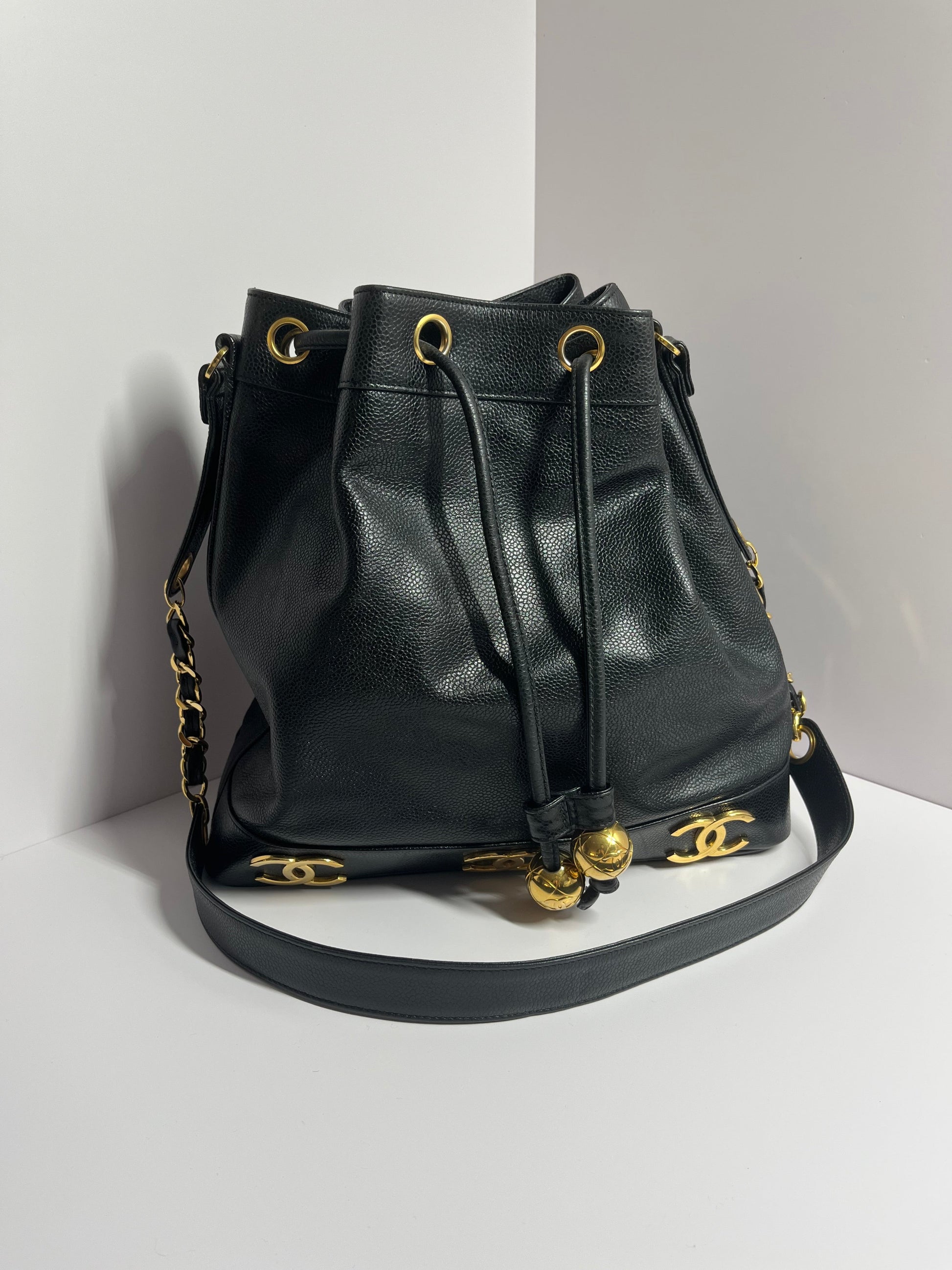 Chanel bucket black leather gold ball shoulder bag